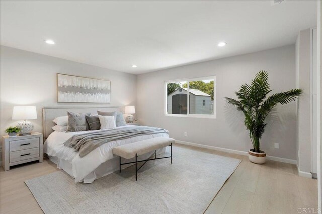 7911 Terraza Disoma, Carlsbad, CA 92009 - bedroom with light wood-type flooring and recessed lighting