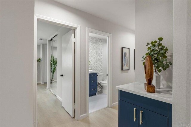 7911 Terraza Disoma, Carlsbad, CA 92009 - corridor with light wood-style flooring and baseboards