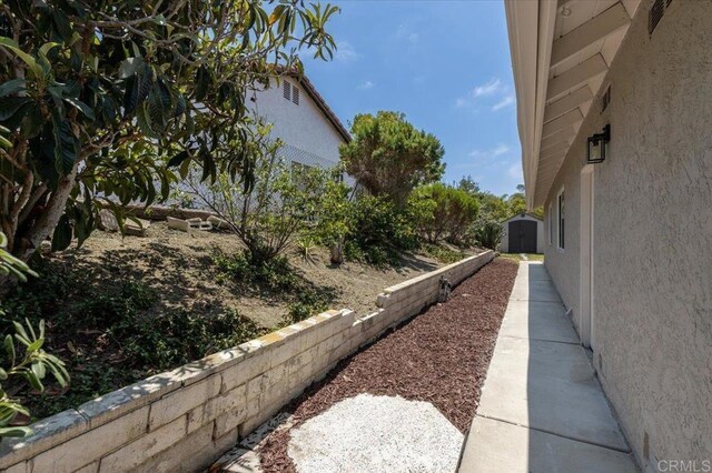 7911 Terraza Disoma, Carlsbad, CA 92009 - view of yard featuring a shed