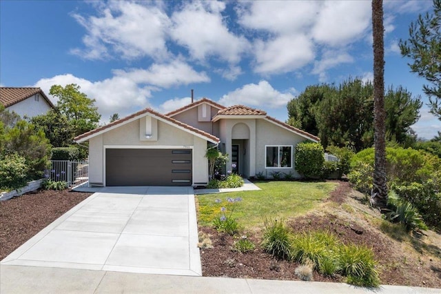 7911 Terraza Disoma, Carlsbad, CA 92009 - mediterranean / spanish-style home featuring stucco siding, concrete driveway, a garage, and a tile roof