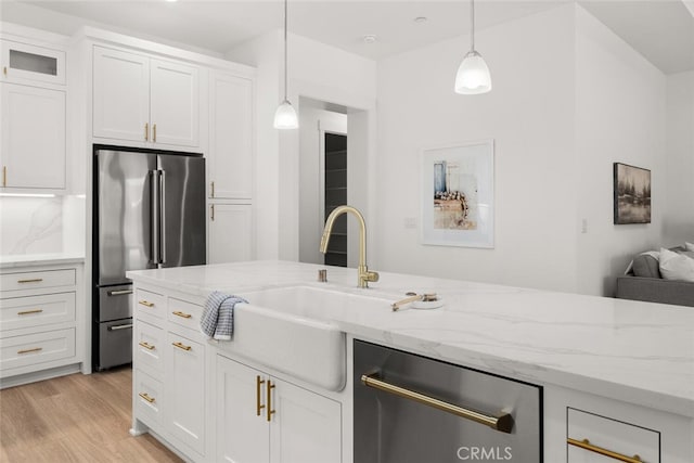 5 Gazania Ct, Chico, CA 95926 - kitchen featuring appliances with stainless steel finishes, light wood-style flooring, and white cabinetry