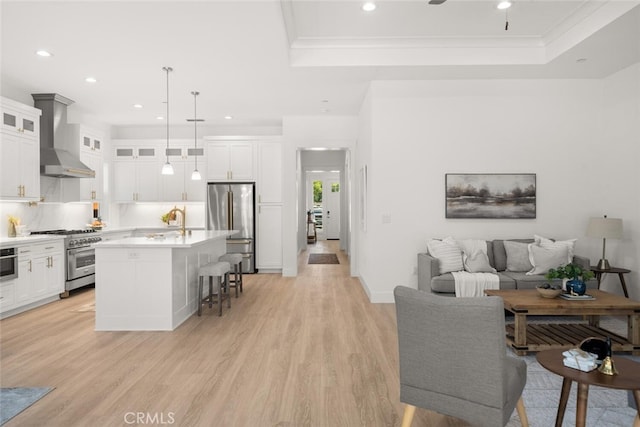 5 Gazania Ct, Chico, CA 95926 - living area with a raised ceiling, recessed lighting, light wood-style flooring, crown molding, and a ceiling fan
