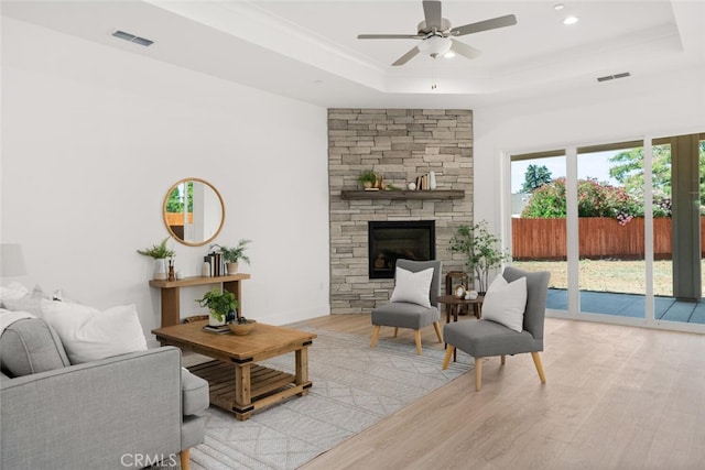5 Gazania Ct, Chico, CA 95926 - living room with a raised ceiling, wood finished floors, a ceiling fan, a fireplace, and recessed lighting