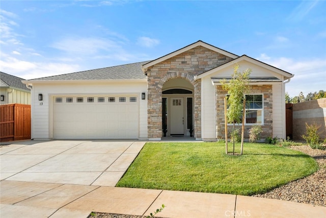 5 Gazania Ct, Chico, CA 95926 - view of front facade featuring stone siding, driveway, and an attached garage