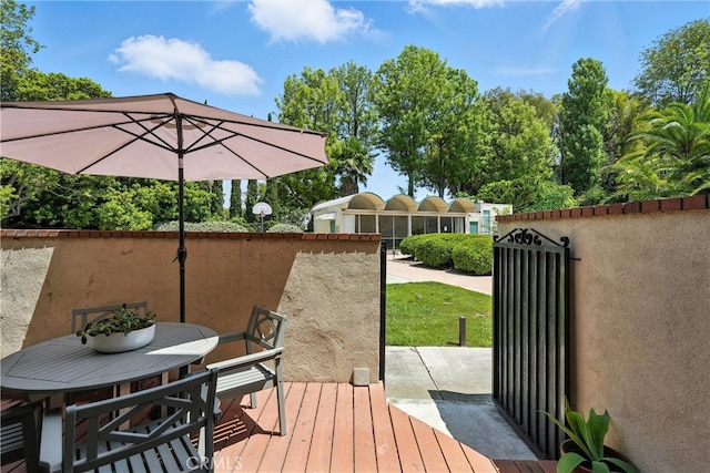 1967 Rolling Vista Dr Unit 58, Lomita, CA 90717 - wooden terrace with outdoor dining area and a gate