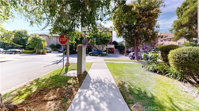 14569 Benefit St Unit 102, Sherman Oaks, CA 91403 - view of asphalt road with traffic signs, a residential view, and sidewalks