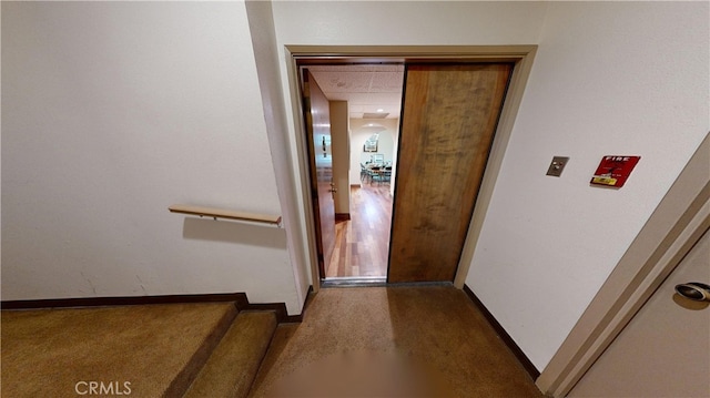 14569 Benefit St Unit 102, Sherman Oaks, CA 91403 - staircase featuring carpet flooring and baseboards