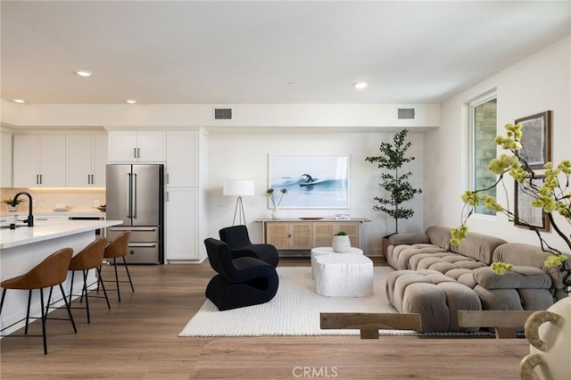 414 Main St Unit 430, Huntington Beach, CA 92648 - living area featuring dark wood-type flooring, recessed lighting, and healthy amount of natural light