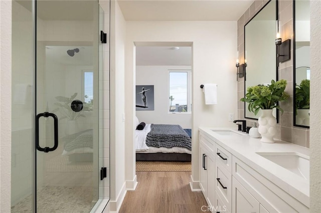 414 Main St Unit 430, Huntington Beach, CA 92648 - full bath featuring wood finished floors, double vanity, a shower stall, and ensuite bath