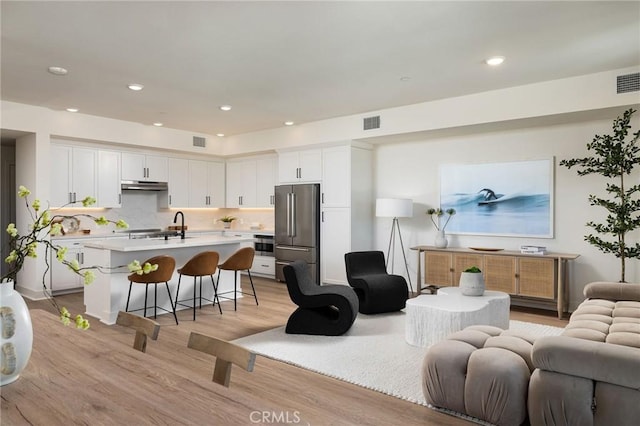 414 Main St Unit 430, Huntington Beach, CA 92648 - living area with light wood-style flooring and recessed lighting