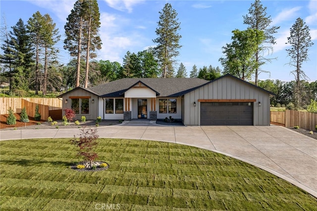 904 Waggoner Rd, Paradise, CA 95969 - modern farmhouse with an attached garage, concrete driveway, roof with shingles, and board and batten siding