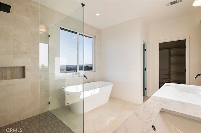904 Waggoner Rd, Paradise, CA 95969 - bathroom with walk in shower, a soaking tub, double vanity, and recessed lighting