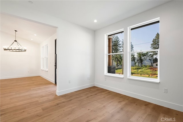 904 Waggoner Rd, Paradise, CA 95969 - spare room featuring a chandelier, healthy amount of natural light, light wood-style flooring, recessed lighting, and lofted ceiling