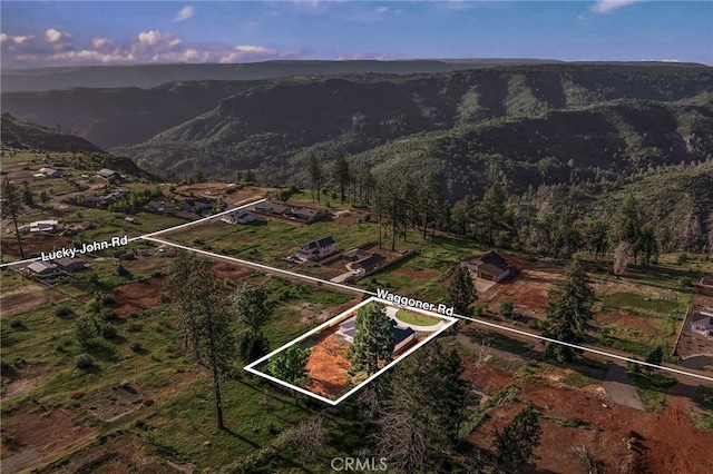 904 Waggoner Rd, Paradise, CA 95969 - aerial view of property and surrounding area with property boundaries highlighted and a mountain backdrop