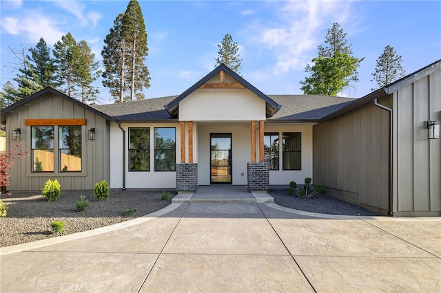 904 Waggoner Rd, Paradise, CA 95969 - view of front of house with board and batten siding, a shingled roof, and covered porch