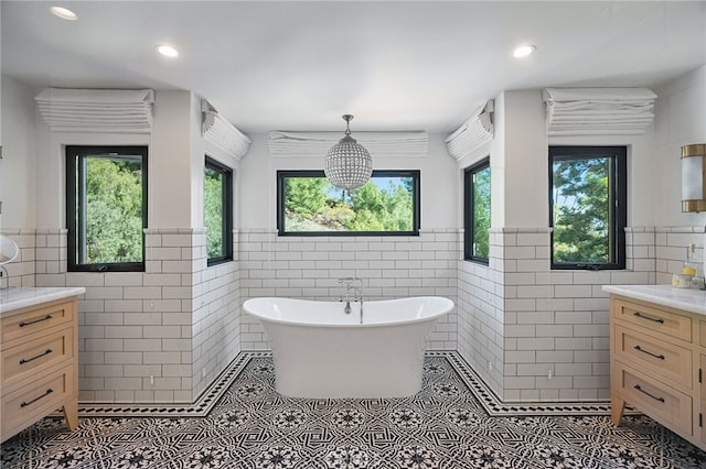 30671 Steeplechase Dr, San Juan Capistrano, CA 92675 - bathroom with tile walls, vanity, tile patterned floors, a freestanding bath, and wainscoting
