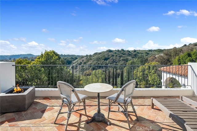 30671 Steeplechase Dr, San Juan Capistrano, CA 92675 - view of patio with an outdoor fire pit, a wooded view, and a mountain view
