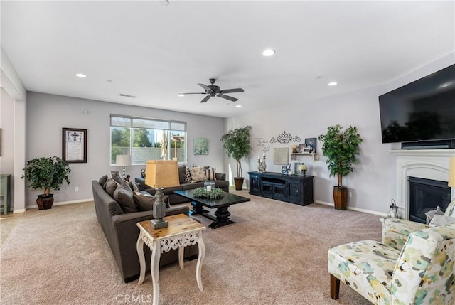 11409 Calle Positas, Jurupa Valley, CA 91752 - living area featuring light colored carpet, recessed lighting, a ceiling fan, and a glass covered fireplace