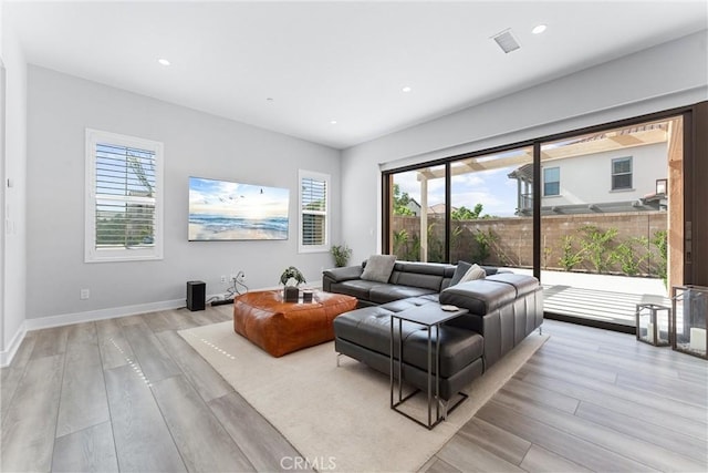 183 Plum Lily, Irvine, CA 92618 - living area featuring light wood-type flooring, plenty of natural light, and recessed lighting