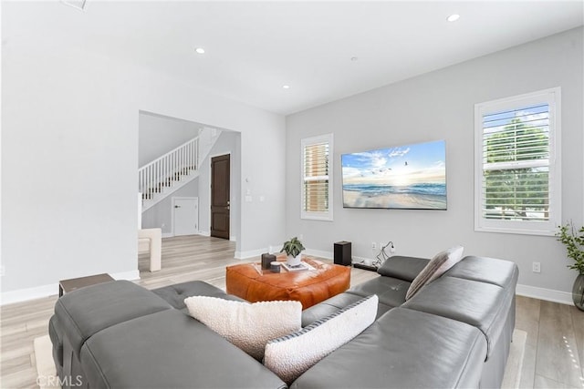 183 Plum Lily, Irvine, CA 92618 - living room with light wood finished floors, stairway, and recessed lighting