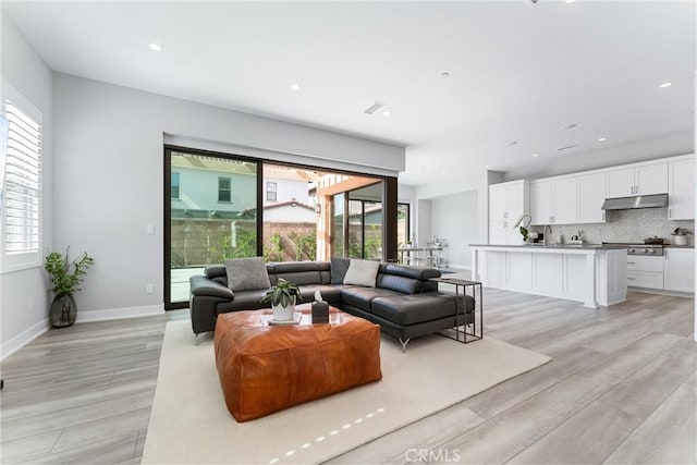 183 Plum Lily, Irvine, CA 92618 - living area with light wood finished floors and recessed lighting