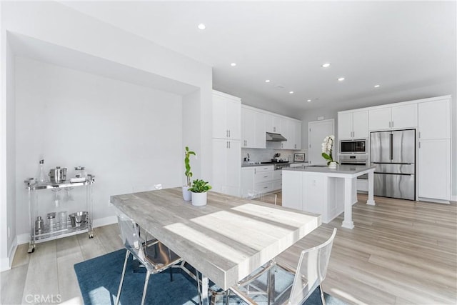 183 Plum Lily, Irvine, CA 92618 - dining room with light wood finished floors and recessed lighting