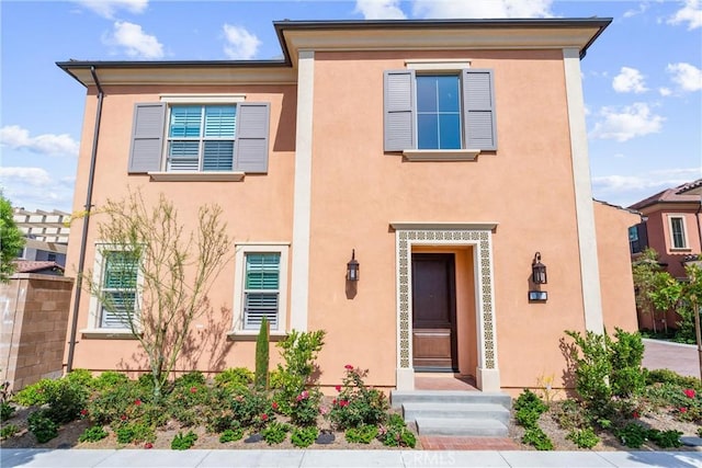 183 Plum Lily, Irvine, CA 92618 - view of front of home with stucco siding
