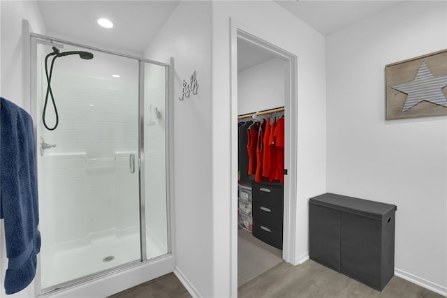 875 Iris Way Unit B, Azusa, CA 91702 - bathroom with a stall shower, a walk in closet, wood finished floors, and recessed lighting