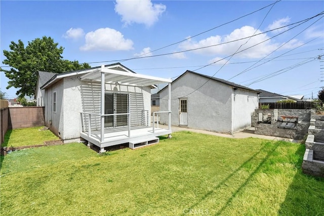 15322 Casimir Ave, Gardena, CA 90249 - rear view of house featuring a wooden deck, a fenced backyard, and stucco siding