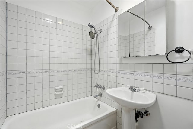15322 Casimir Ave, Gardena, CA 90249 - full bathroom with tub / shower combination, tile walls, and decorative backsplash