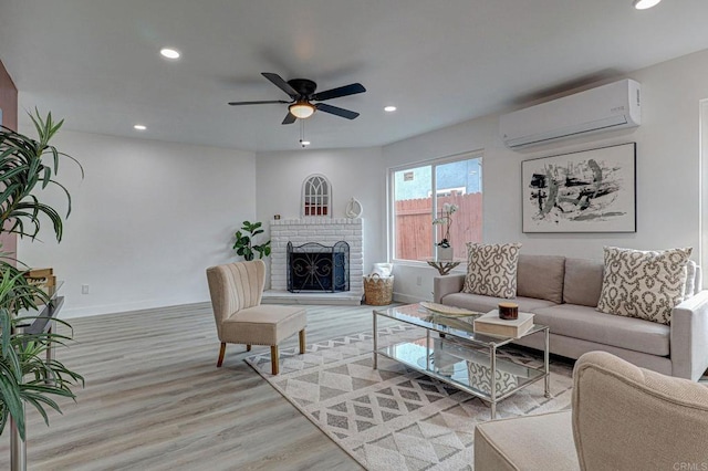 1320 Vinca Way, San Diego, CA 92113 - living area with a wall unit AC, light wood-type flooring, recessed lighting, ceiling fan, and a fireplace