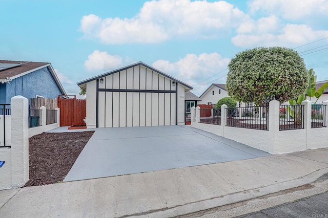 1320 Vinca Way, San Diego, CA 92113 - view of front of home featuring board and batten siding, driveway, and a garage