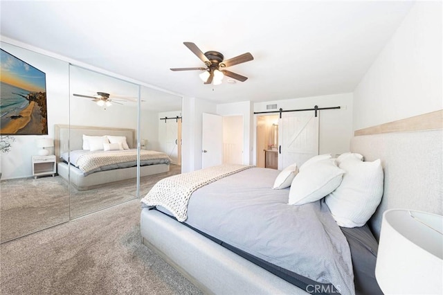 20004 Waverly Glen St Unit 46, Yorba Linda, CA 92886 - carpeted bedroom featuring a barn door, a closet, and ceiling fan