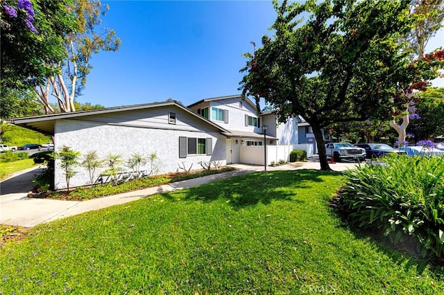 20004 Waverly Glen St Unit 46, Yorba Linda, CA 92886 - view of front facade with stucco siding, an attached garage, and driveway