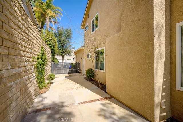 21658 Canyon Heights Cir, Saugus, CA 91390 - view of home's exterior featuring stucco siding and a patio area