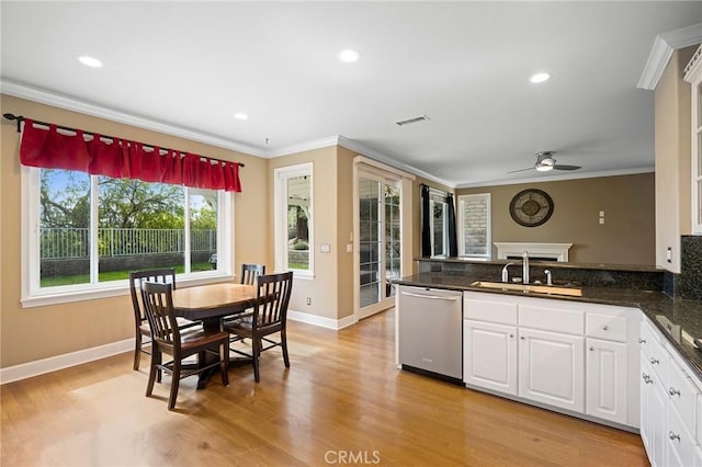 21658 Canyon Heights Cir, Saugus, CA 91390 - kitchen featuring dishwasher, a peninsula, crown molding, white cabinets, and ceiling fan