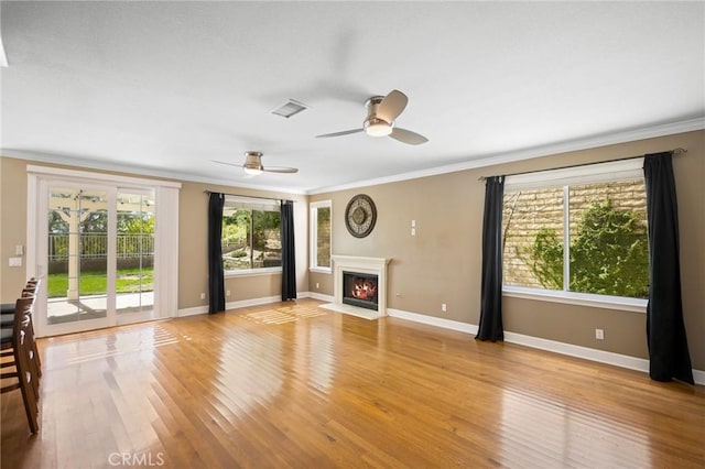 21658 Canyon Heights Cir, Saugus, CA 91390 - unfurnished living room with crown molding, light wood-style floors, a fireplace with flush hearth, and ceiling fan
