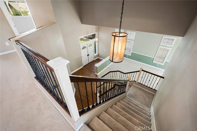 21658 Canyon Heights Cir, Saugus, CA 91390 - stairs with baseboards and carpet floors