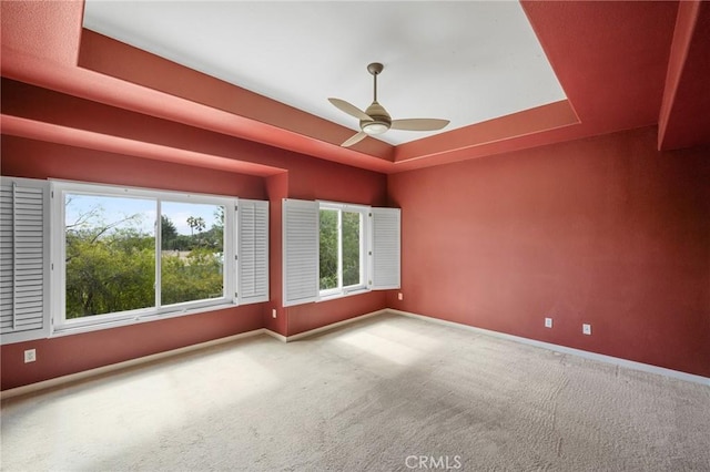 21658 Canyon Heights Cir, Saugus, CA 91390 - carpeted spare room featuring a tray ceiling, ceiling fan, and healthy amount of natural light