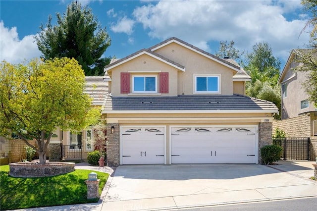 21658 Canyon Heights Cir, Saugus, CA 91390 - view of front of property with a garage, driveway, stucco siding, and a tiled roof