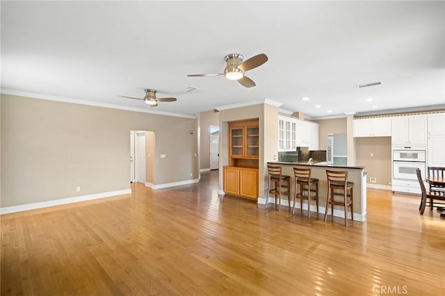 21658 Canyon Heights Cir, Saugus, CA 91390 - living area featuring ornamental molding, ceiling fan, light wood-type flooring, and recessed lighting