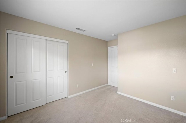 21658 Canyon Heights Cir, Saugus, CA 91390 - unfurnished bedroom featuring light carpet and a closet