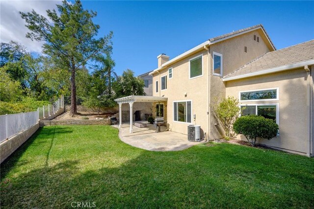 21658 Canyon Heights Cir, Saugus, CA 91390 - back of house with a pergola, stucco siding, a fenced backyard, a chimney, and a patio