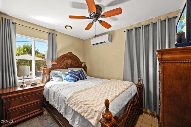 215 Bridewell St, Los Angeles, CA 90042 - bedroom featuring an AC wall unit, a ceiling fan, and tile patterned floors