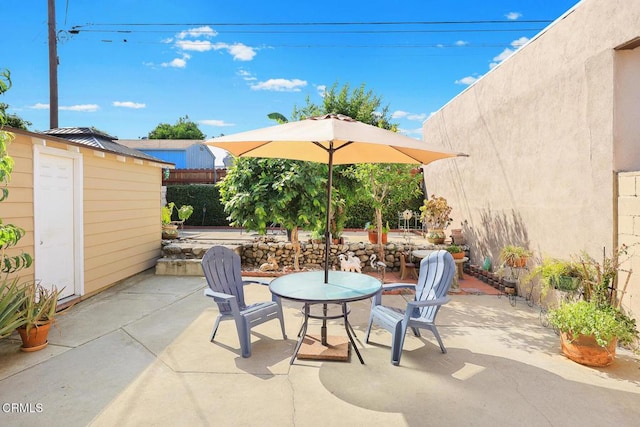 215 Bridewell St, Los Angeles, CA 90042 - view of patio / terrace featuring a storage shed and outdoor dining space