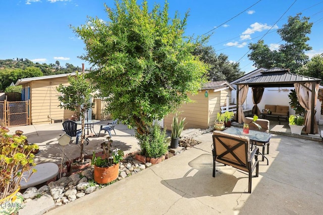 215 Bridewell St, Los Angeles, CA 90042 - view of patio / terrace with a gazebo, a storage unit, and outdoor lounge area