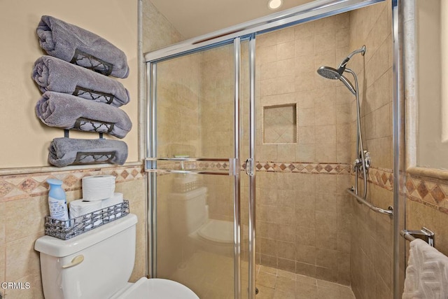 215 Bridewell St, Los Angeles, CA 90042 - full bath with tile walls, a wainscoted wall, and a shower stall