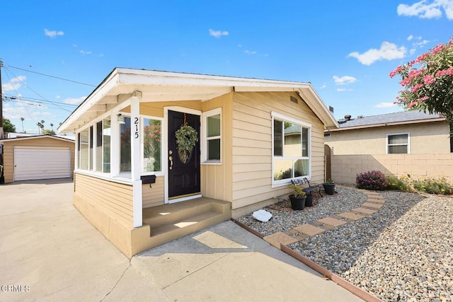 215 Bridewell St, Los Angeles, CA 90042 - view of front of property featuring an outdoor structure, a garage, and entry steps
