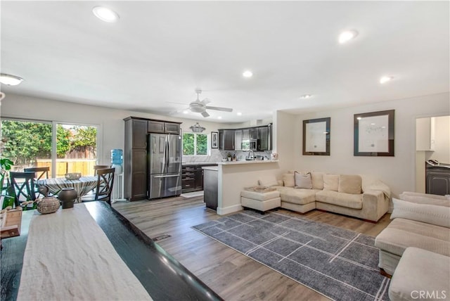 1212 Dover Dr, Newport Beach, CA 92660 - living area featuring healthy amount of natural light, ceiling fan, wood finished floors, and recessed lighting