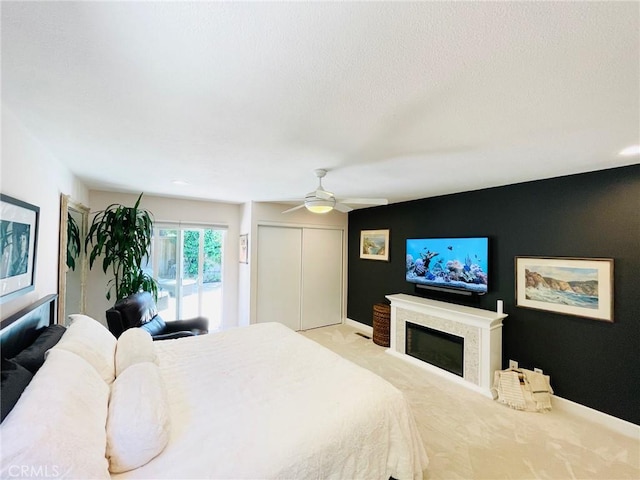 1212 Dover Dr, Newport Beach, CA 92660 - bedroom with a fireplace, carpet, a ceiling fan, and a closet